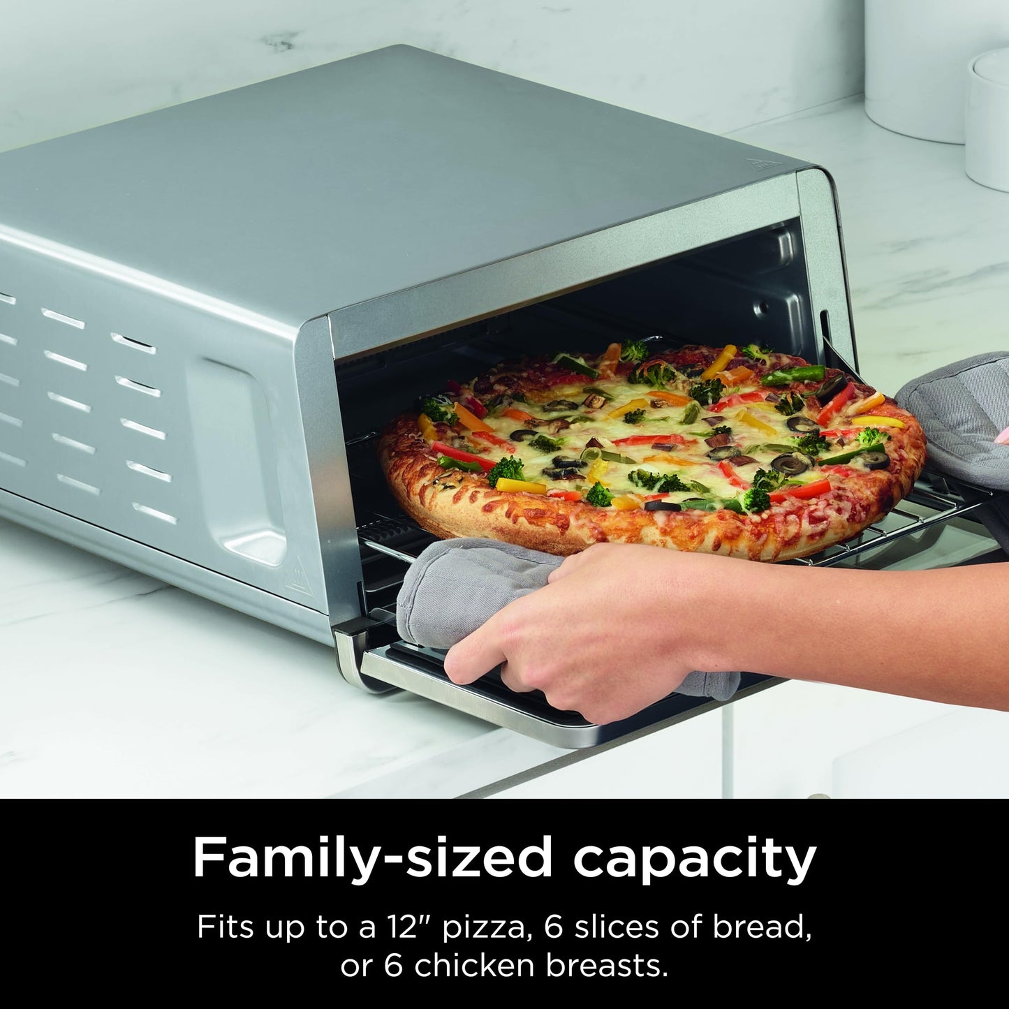 Ninja SP151 Oven: 8-in-1 air fryer toaster oven, flip-up design, space-saving, includes basket, pan, and rack.