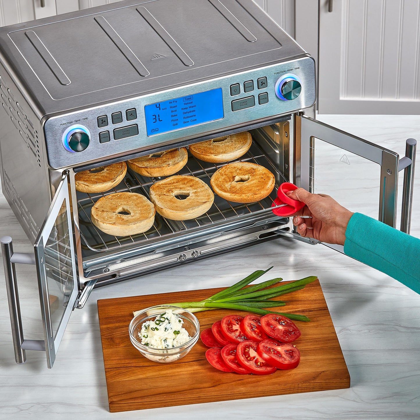 Emeril Lagasse Dual Zone Oven: 25QT air fryer oven, dual cooking zones, fast cooking, French doors, large capacity.